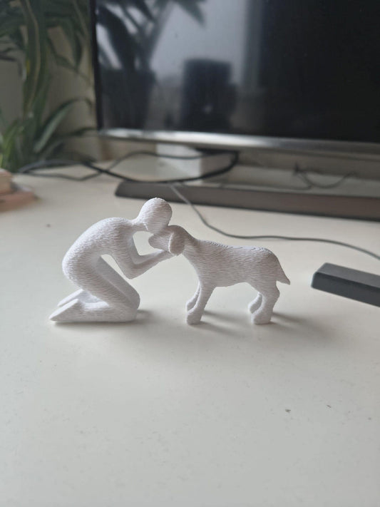 Beeldje van baasje met hond