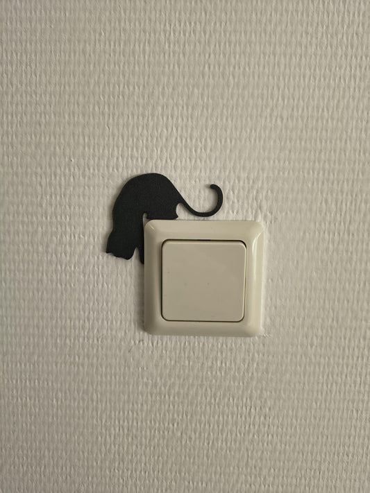 Katten lichtschakelaar decoratie van een kat die langs een lichtschakelaar kijkt. Te monteren zonder boren