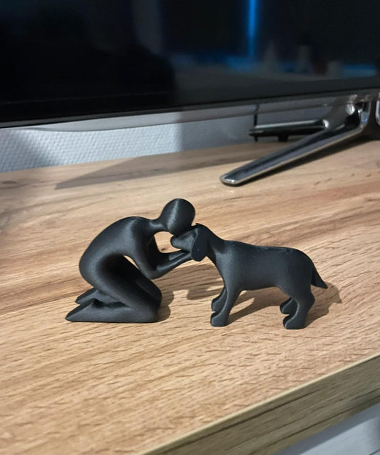 Beeldje van baasje met hond